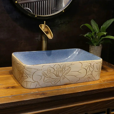 USZWBY Vessel Sinks Vessel Sink Lotus Pattern Art Countertop Basin Rectangular Ceramic Washbasin with floral design.