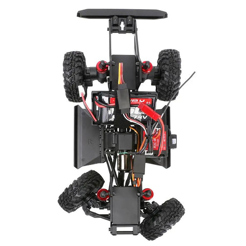 Underside view of Redcat Racing Ascent 18 Scout II Brushless 4x4 One Eighteenth Scale RC Crawler showcasing chassis and tires