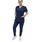 Womens Five Pocket V Neck Scrub Top For Medical Bosses Straight Fire Navy Nursing Uniform Featuring Relaxed Stretch Fabric For All Day Clinic Comfort And Fresh Style, model wearing navy scrub top and pants.