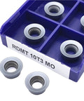 Heavy Duty Indexable Carbide Lathe Tool For Rdm10t3 set of inserts in a compartmentalized box, designed for milling and turning metals.