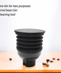 Premium Coffee Grinder Single Dose Funnel With Compact Air Blower And Durable Silicone Bean Hopper on a wooden table.
