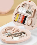 Compact Travel Sewing Kit Two Pack Featuring Adorable Heart Shaped Cases Pink And Blue, open kit showing threads, scissors, and needles.