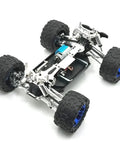 Level Up Your Bash Truck Setup With These Built Tough Aluminum Steering Blocks And Rear Wheel Hubs Crafted To Deliver Superior Grip As Direct Fit Replacement For 144016 144018 Rc Crawlers In Bright Yellow Finish, showcasing a rugged RC truck chassis with blue wheels.