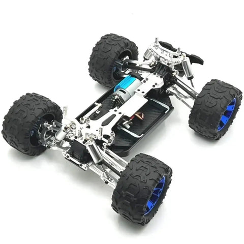 Level Up Your Bash Truck Setup With These Built Tough Aluminum Steering Blocks And Rear Wheel Hubs Crafted To Deliver Superior Grip As Direct Fit Replacement For 144016 144018 Rc Crawlers In Bright Yellow Finish, showcasing a rugged RC truck chassis with blue wheels.