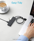 4 Port USB 3.0 Hub For Laptops And PCs, Ultra Fast 5Gbps Data Transfer, Turns One USB Port Into Four, USB Splitter For Desktop Or Travel, Charging Not Supported connected to a laptop on a desk, cable tie included.