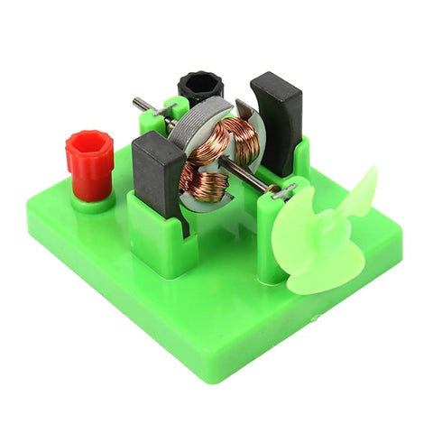 Hands On Circuit And Motor Lab Kit For Students DIY DC Motor Model on green base with visible copper coil and plastic fan blade.