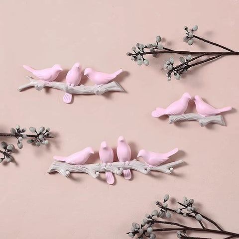Chic Five Hook Wall Mounted Coat Rack With A Cool Blue Bird Vibe features pink bird designs on branches for decorative storage.