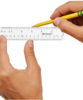 Hands holding Crystal Clear Acrylic Ruler 6 Inch Beveled Edge With Easy To Read Markings, clear view of both scales.