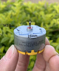 Close-up of Two Pack RC500 KN Mini 32mm Round Spindle Motor DC 6V 12V 5300 RPM with dimensions M2.5 and 22mm visible