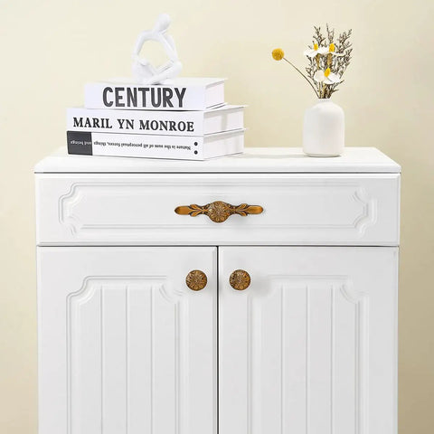 White cabinet with Antique Brass Round Cabinet Knobs And Drawer Pulls Set, 10 Pack, 1.4 Inch, floral motif, zinc alloy hardware.