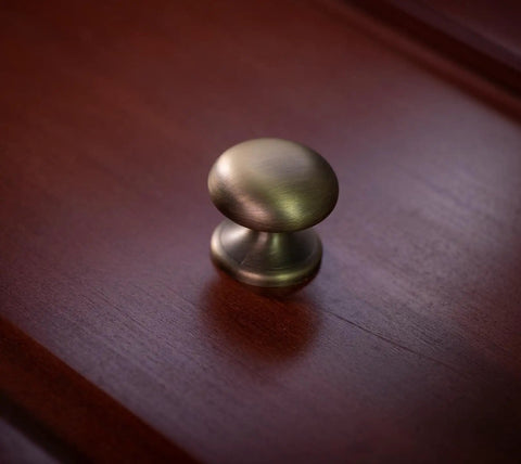 Close-up of 4 Pack 1.5 Inch Large Brushed Antique Brass Bi Fold Closet Door Knob With Wide Backplate For Weathered Gold Dresser Hardware