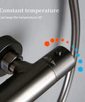 Close-up of wall mounted thermostatic shower temperature control, features gray brass finish, maintains 38° for ideal bathing.