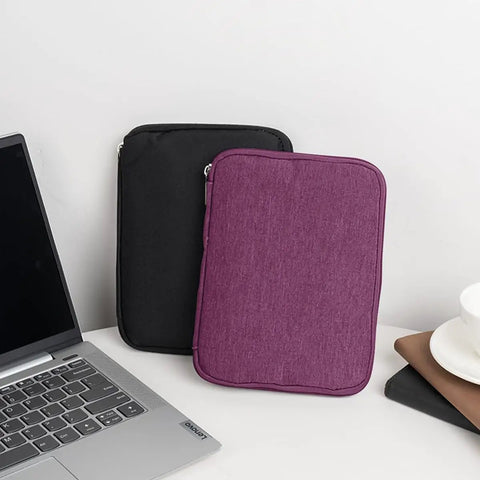 Travel Ready Watch Band Organizer Case With Waterproof Nylon Zipper Closure Ample Pocket Space, purple and black cases on desk.