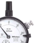 Close-up of a dial indicator with 0.01mm graduation, showing measurement range, lug back, and stainless steel stem design.