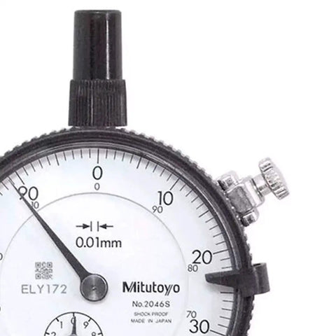 Close-up of a dial indicator with 0.01mm graduation, showing measurement range, lug back, and stainless steel stem design.
