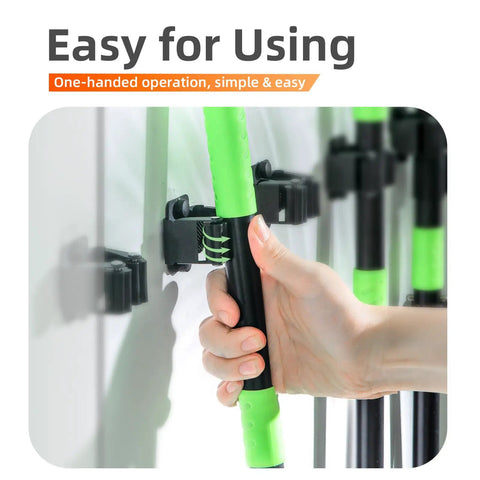 Hand holding tool in 5 Pack Heavy Duty Wall Mount Broom Holder Rack For Mop Broom Rake And Garden Tools Stainless Steel Hanger