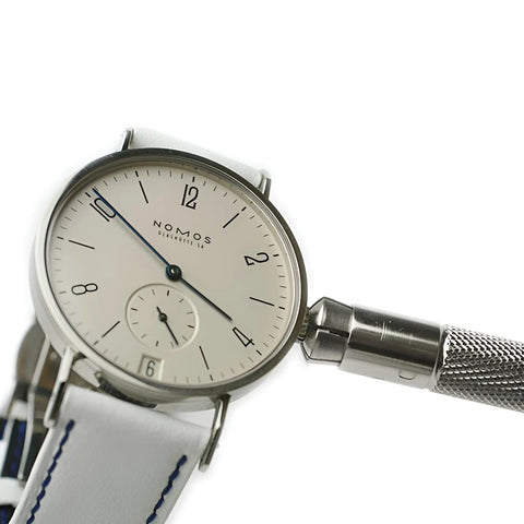 Watch Crown Winder Tool 3.5mm To 5.5mm Adjustable Manual Winding Tool For Mechanical Watches next to a luxury watch.