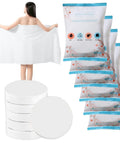 Woman holding expanded towel from Six Pack Large Compressed Towels That Expand To 56 By 28 Inch Bath Towels When Wet Disposable Cotton Towels