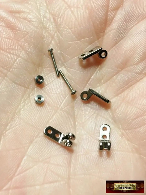 Five Packs Of Two Micro Hinges Ten Piece Miniature Puppet Hinge Set For Ball Socket Wrist Knee And Elbow Joints Stop Motion Animation Armature Includes Ten Screws For Puppet Pros And Model Makers, 16mm silver hinges and screws in hand