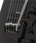 Spirit GT Pro Deluxe Black Electric Guitar With Gig Bag Maple Body Locking Tremolo R Trem System Humbucker Neck Pickup And Single Coil Middle Pickup Lightweight Built For Stage Ready Studio And Street Jams close-up of black R-Trem bridge and Steinberger neck pickup