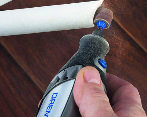 Person using EZ SpeedClic Sanding Bands And Mandrel Set With Two 13 Mm Sanding Bands Grit 60 And 120 Plus One EZ SpeedClic Mandrel on plastic