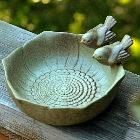 Ceramic Bird Bath Bowl For Outdoor Garden Waterer And Feeder Sturdy Bird Water Dish Easy To Clean Attract Birds To Your Backyard Courtyard Patio Decor Ideal For Garden Or Balcony in a rustic design with bird figurines.