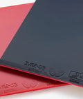 Red Zyre 03 High Tension Inverted Table Tennis Rubber With Spring Sponge X And Ricosheet, angled stack view.