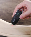 Digital Tape Measure With Laser Rechargeable Smart Measuring Tool For Flat Curved And Odd Shapes Bluetooth App Connectivity Pocket Size Dope Gadget For DIY Fans And Pros Perfect Fathers Day Gift For Dad Men Husbands handheld on curved wood surface