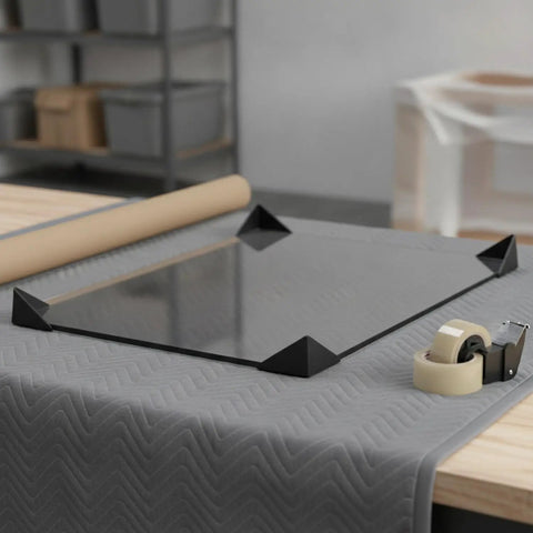 Beefy Corner Protectors For Shipping And Handling on glass slab with tape and cushion, shock absorbing cushioned packaging for transit.