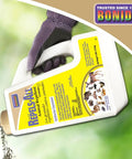 Hand holding 3 lb bottle of Deer And Rabbit Repellent Granules For Lawn And Garden Ready To Use No Fuss 3 Lb Bag Deters Pests In Your Yard