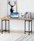 Office space with Beefy Industrial Pipe Desk Leg Set 28 Inch Heavy Duty Vintage Style Furniture Legs For Dining Tables Coffee Tables Benches Set Of 2 Durable Cast Iron Hardware supporting a wooden tabletop with a laptop, books, and decor.