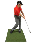 Golfer practicing swing on green mat with iron club using Chip Stix Golf Swing Trainer Aid Chip N Pitch Mastery Black And Green