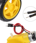 Close-up of Prewired TT Gear Motor Wheel Kit For RC Cars And Robots, yellow gearbox with 69mm tire and wire connectors