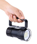 Person holding Beast Mode Dive Light 18000 Lumen Diving Flashlight Waterproof IPX8 For Scuba And Night Dives, Submersible LED Torch