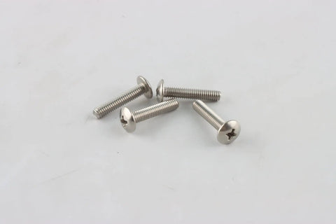 Four silver screws on a white surface designed for Door Stop Rubber Tip With Screw In Replacement Tips For Drop Down Door Holders Black Rubber 4 Pack.