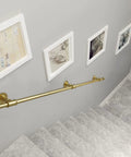 Heavy Duty Wrought Iron Wall Mount Grab Rail Kit For Indoor Outdoor Stair Safety Support Rustproof Banister Handle Built Damn Tough For Easy Home Accessibility And Rock Solid Grip mounted on a gray wall beside framed artwork.