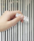 10 Pc Vertical Blind Repair Tabs Heavy Duty Metal Vane Savers Universal Fit held in hand, ready for installation on vertical blinds.