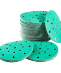 Get A Solid 20 Pack of 6 Inch Hook And Loop Sanding Discs With Assorted Grits From 60 To 2000 Plus Extra Durability Heat And Humidity Resistance For Any Quick Home Improvement Project Or Woodworking Hustle Today, showing stacked discs.