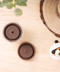 Upgrade Your Coffee Game With This Reusable Capsule Set For VertuoLine Machines, showing top view of capsule and silicone lid