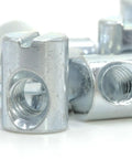 Top Tier Replacement Cross Dowel Barrel Nuts Compatible With Ikea Part 100514 For Crib And Bunk Bed Frames. Close-up of zinc plated steel nuts.