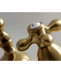 Close-up of Brushed Brass Centerset Bathroom Faucet handles, classic 19th-century style, solid brass construction, ceramic disc.