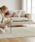 Super Slick U Shaped Baby Proofing Corner Guards For Glass Tables And Thin Furniture, soft EVA foam edge protectors on a glass table.