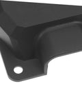 Close-up of black heavy-duty plastic protective junction box corner detail with mounting hole for welding machines.