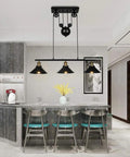 Three Light Pulley Pendant Island Light With Industrial Vintage Rustic Vibe in modern kitchen over 7ft dining table.