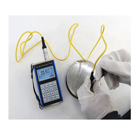 Grab And Go Digital Leeb Hardness Tester For Steel And Alloys With Knockout Accuracy Up To 960Hld measuring steel sample with digital readout.