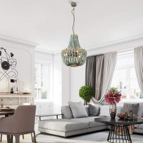 Three Light Wood Beaded Chandelier in Rustic Farmhouse Vibe hanging in modern living room with white beaded shade.