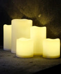 Outdoor IP44 Weatherproof 4x6 Inch Warm White LED Flameless Pillar Candles Set Of 2 With Remote And Timer Resin on table