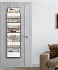 Seven Tier Over Door Hanging Storage Rack With Plentiful Mesh Side Pockets For Closets And Baths placed on a door showcasing various items.