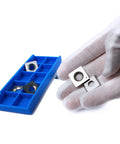 Top Tier R150 Radius Carbide Inserts For Spiral Helical Cutterheads 15X15X2.5Mm in hand, pack shows multiple indexable cutting tips.
