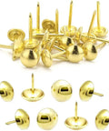 Tough As Nails Gold Metal Upholstery Tacks For Furniture Fixes And Slick Diy Upgrades 500 Pack Heavy Duty Brass Thumb Nails With Rust Resistant Coating For Sofas Chairs, close-up of various gold upholstery tacks.